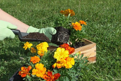 Insured gardeners carrying out professional outdoor work in Northolt